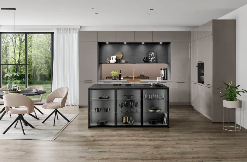 Modern kitchen island featuring illuminated glass display cabinets adding depth to a natural living design. 